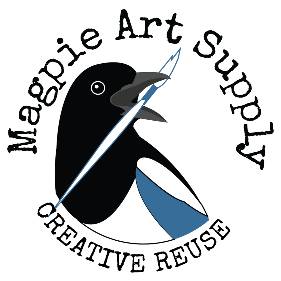 Magpie Art Supply logo is a magpie's black, white, and blue head and upper body looking to the right and holding a paint brush in its open beak